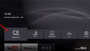 Smart TV menu interface with the "Watch TV" option highlighted by a red arrow.